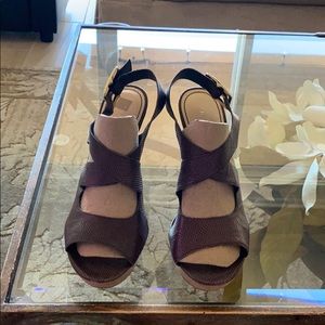 Platform hi heel brown sandals.